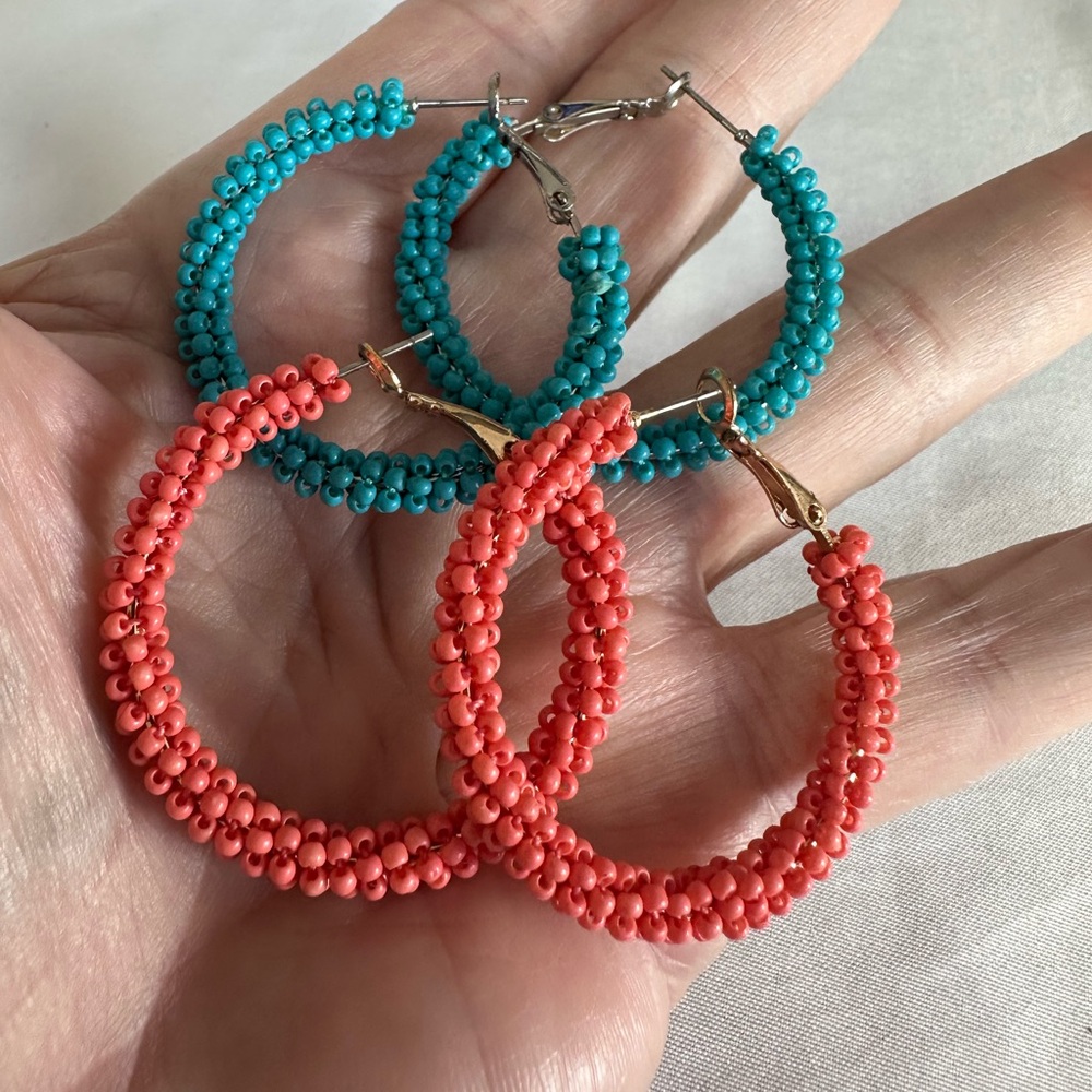 Two pair of beaded hoop earrings